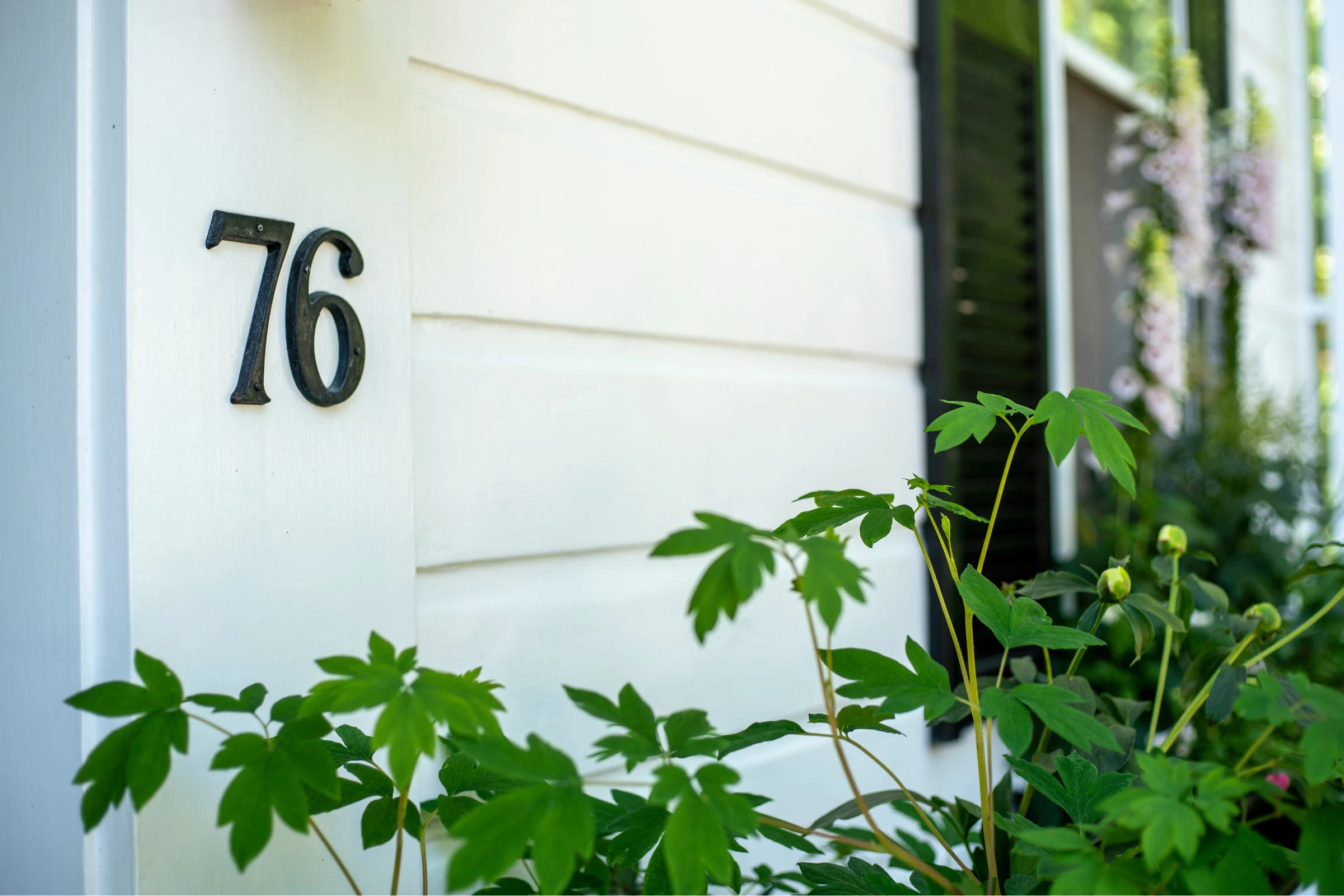 Close up of the house number on the 76 Main Ink Press Hotel