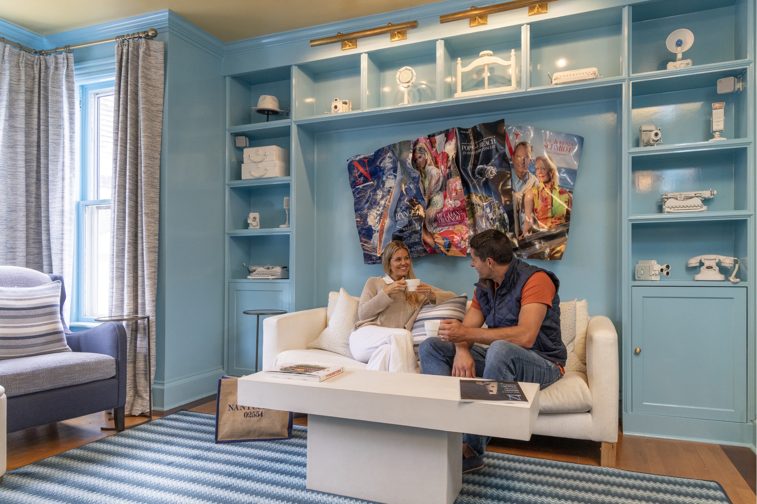 Couple sitting in the 76 Main Ink Press Hotel library