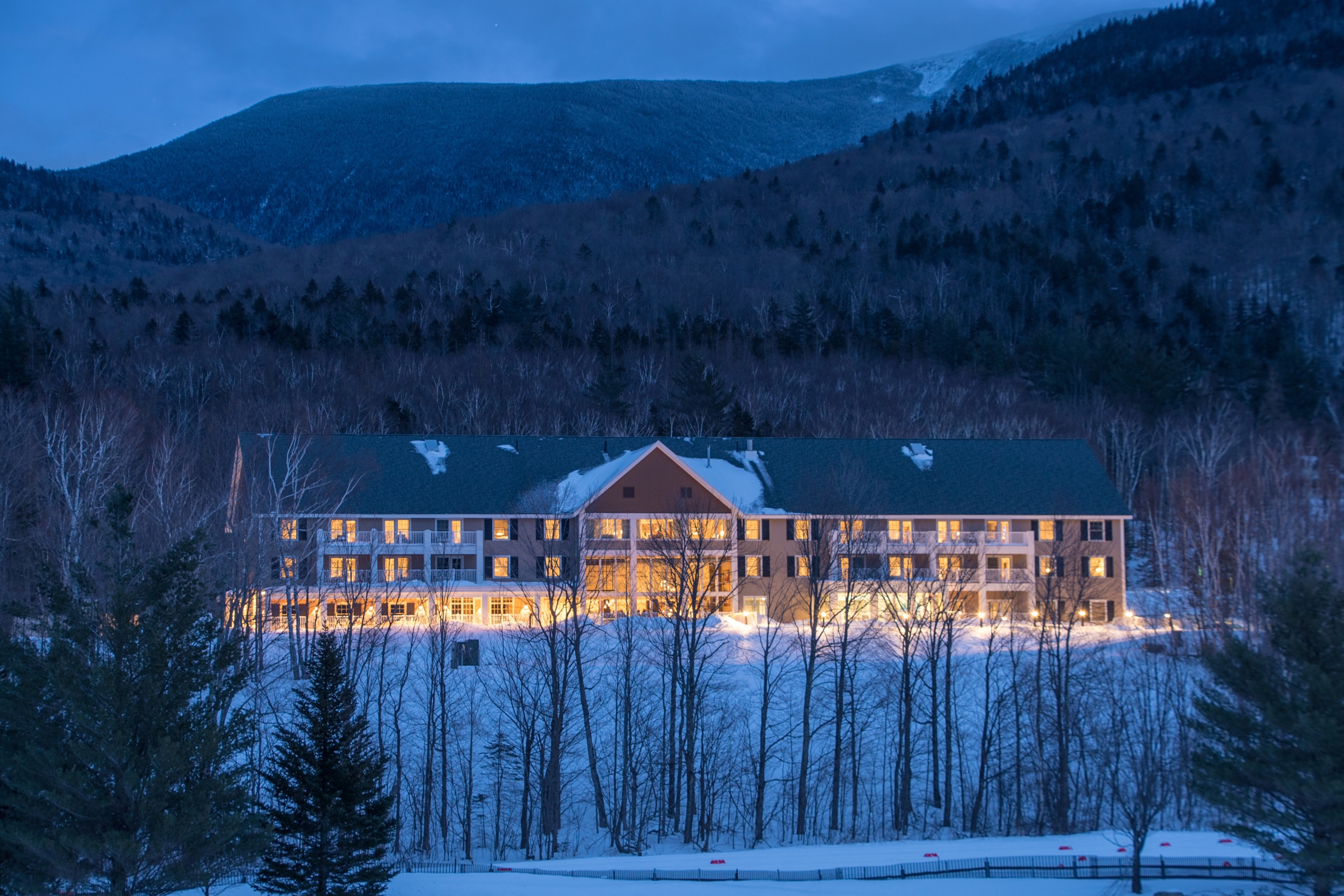 The Glen House hotel lit up at night during the winter