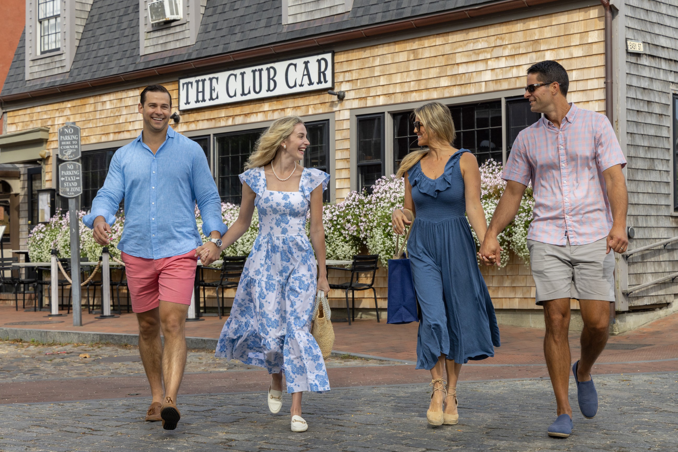 Two couples walking out of The Club Car in Nantucket