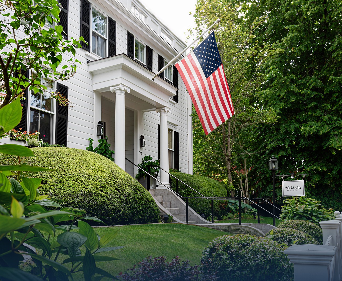 Exterior shot of 76 Main with an American Flag out front